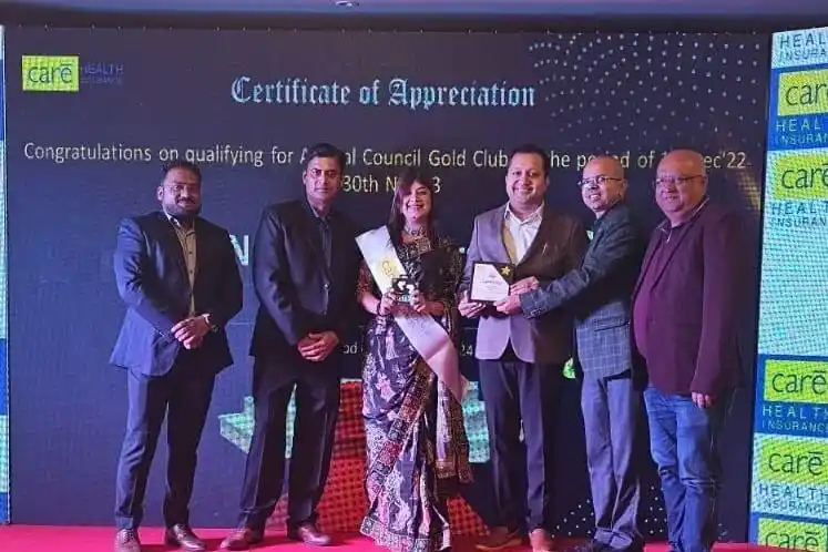 Happy Indian family protected by comprehensive health and life insurance coverage from Sampurn Insurance