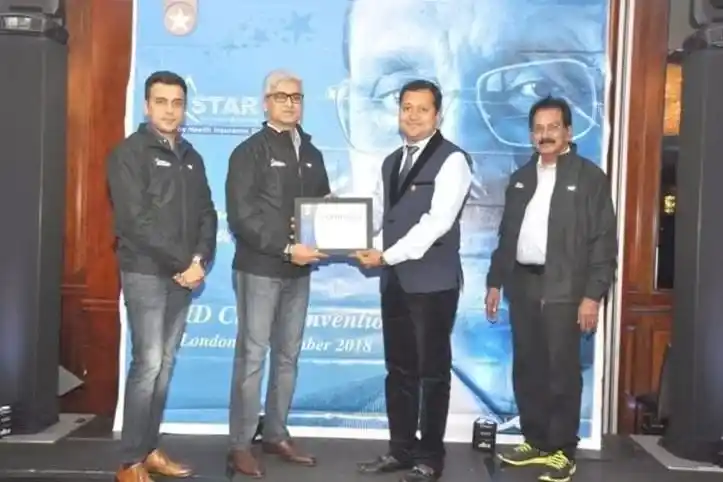 Happy Indian family protected by comprehensive health and life insurance coverage from Sampurn Insurance